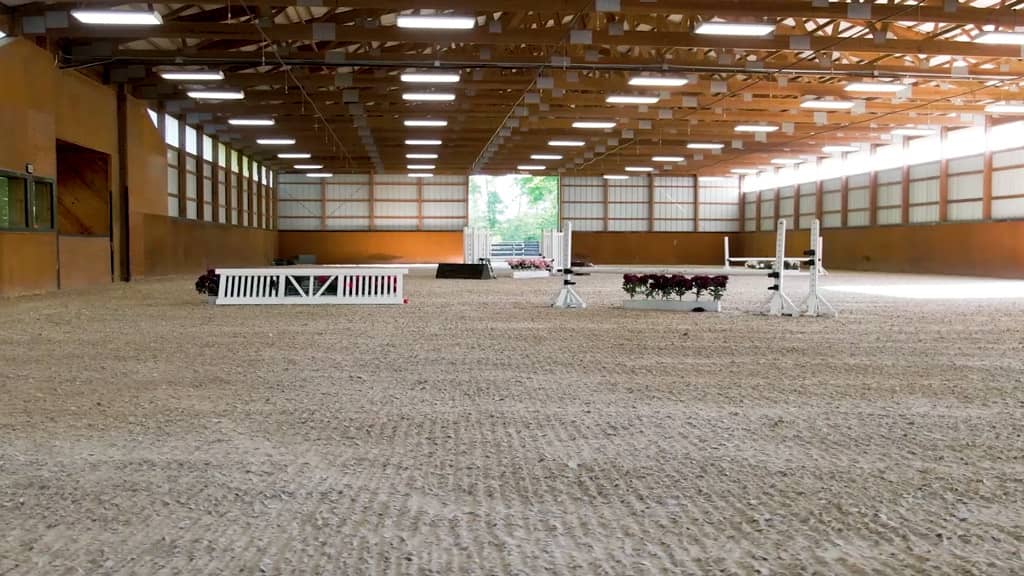 Photo inside an arena meeting top arena standards at Still Water Farms